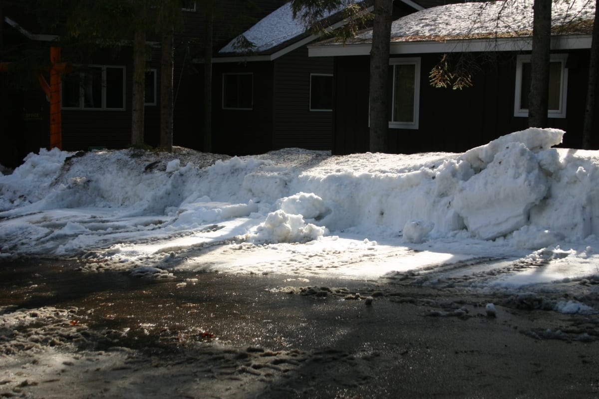 Over half of the snow bank gone.