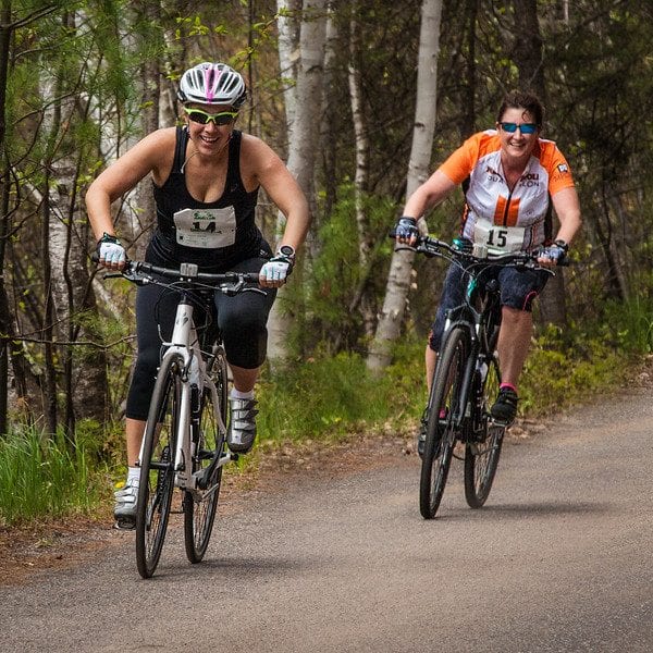 Deb and Jill riding their bikes.