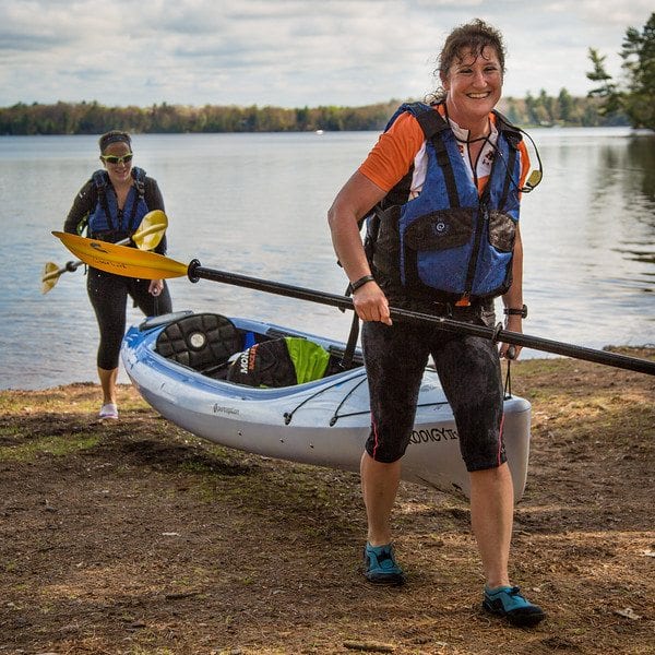 Deb and Jill finish the paddle portion of the race.